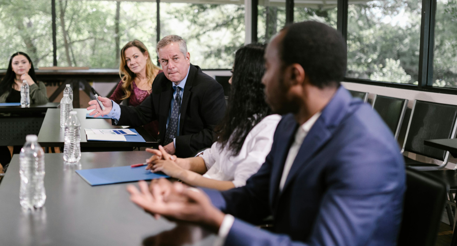 Meeting facilitation with leaders around a table